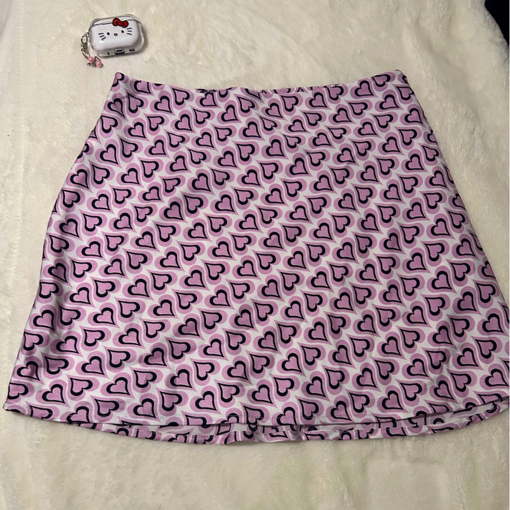 I am selling a pink heart skirt! It is very cute but sadly never worn it.